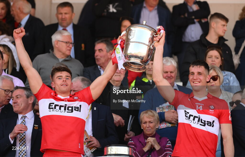 29 May 2022; Conor Doherty, left, and Shane McGuigan of Derry lift the Anglo Celt Cup after the Ulster GAA Football Senior Championship Final between Derry and Donegal at St Tiernach's Park in Clones, Monaghan. Photo by Stephen McCarthy/Sportsfile