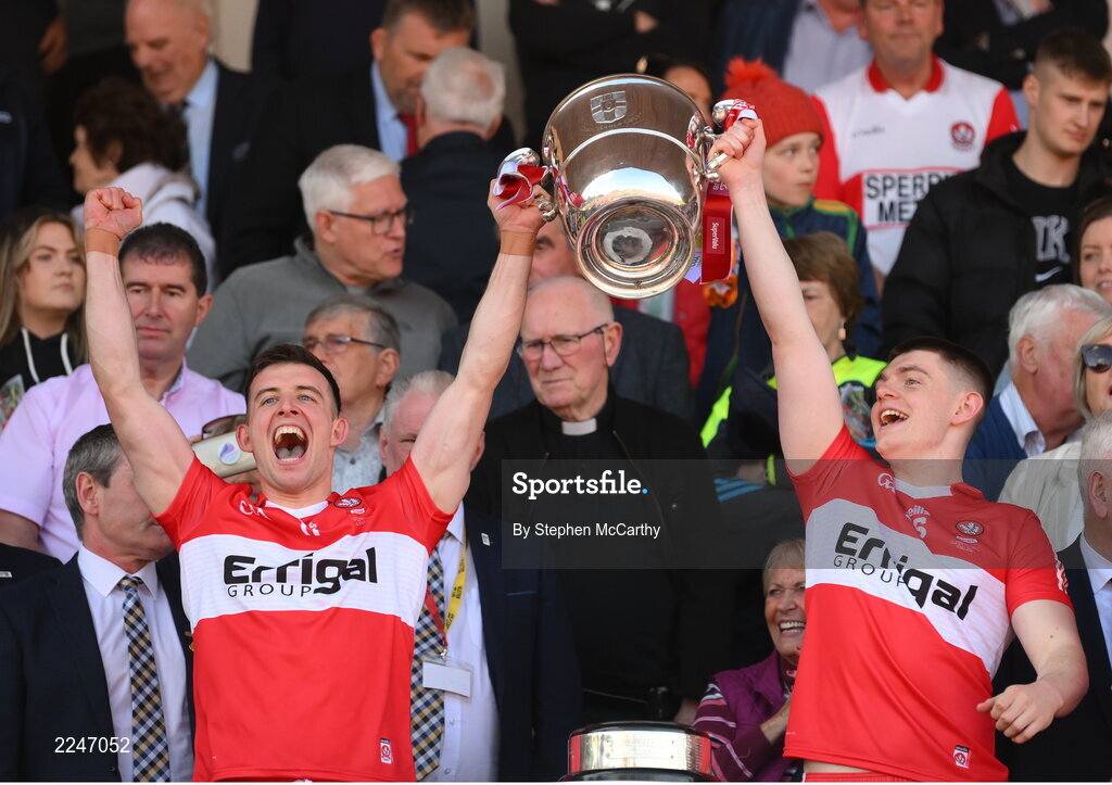 29 May 2022; Shea Downey, left, and Matthew Downey of Derry lift the Anglo Celt Cup after the Ulster GAA Football Senior Championship Final between Derry and Donegal at St Tiernach's Park in Clones, Monaghan. Photo by Stephen McCarthy/Sportsfile