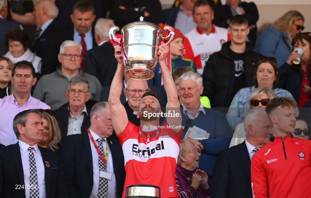 29 May 2022; Niall Loughlin of Derry lifts the Anglo Celt Cup after the Ulster GAA Football Senior Championship Final between Derry and Donegal at St Tiernach's Park in Clones, Monaghan. Photo by Stephen McCarthy/Sportsfile