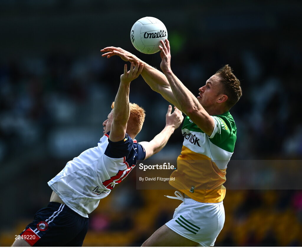 4 June 2022; Adrian Varley of New York in action against Declan Hogan of Offaly during the Tailteann Cup Quarter-Final match between Offaly and New York at O'Connor Park in Tullamore, Offaly. Photo by David Fitzgerald/Sportsfile