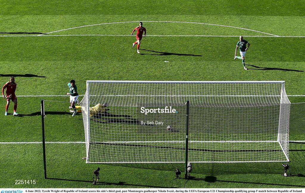 6 June 2022; Tyreik Wright of Republic of Ireland scores his side's third goal, past Montenegro goalkeeper Nikola Ivezic, during the UEFA European U21 Championship qualifying group F match between Republic of Ireland and Montenegro at Tallaght Stadium in Dublin. Photo by Seb Daly/Sportsfile