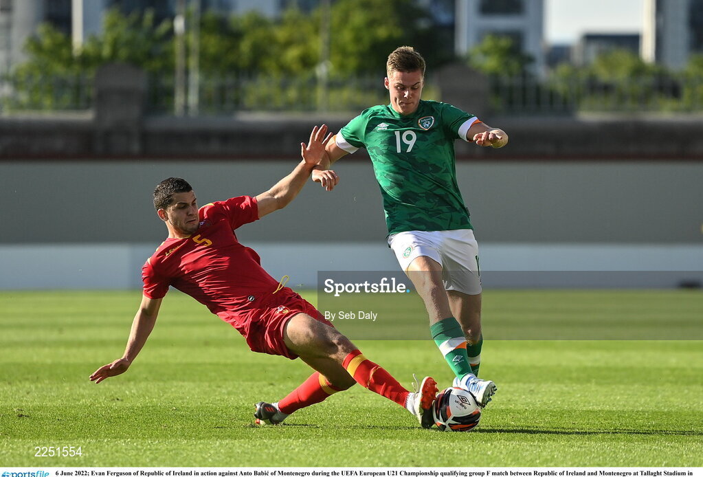 6 June 2022; Evan Ferguson of Republic of Ireland in action against Anto Babic of Montenegro during the UEFA European U21 Championship qualifying group F match between Republic of Ireland and Montenegro at Tallaght Stadium in Dublin. Photo by Seb Daly/Sportsfile