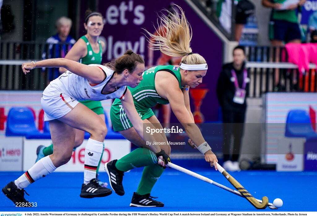 6 July 2022; Caoimhe Perdue of Ireland in action against Amelie Wortmann of Germany during the FIH Women's Hockey World Cup Pool A match between Ireland and Germany at Wagener Stadium in Amstelveen, Netherlands. Photo by Jeroen Meuwsen/Sportsfile