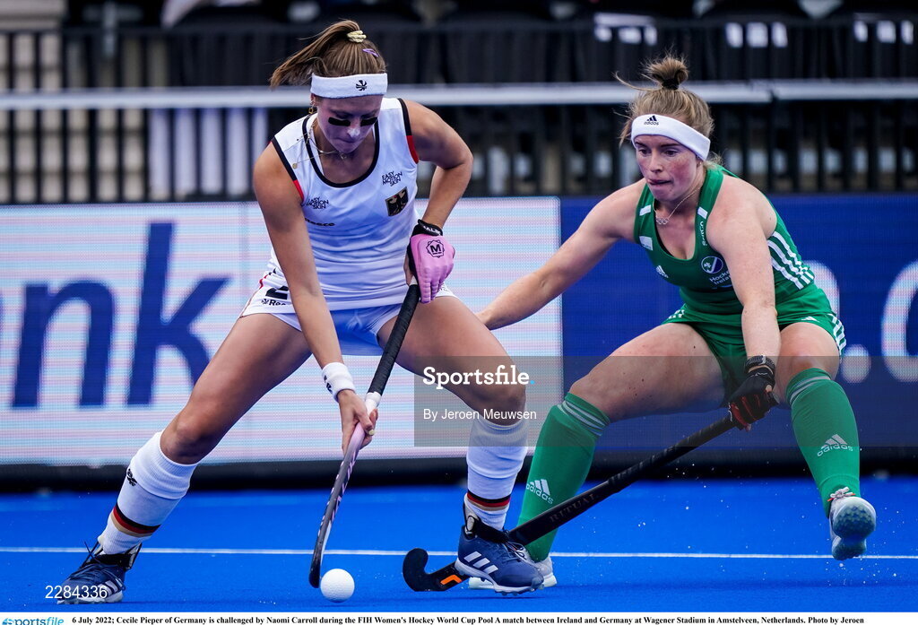 6 July 2022; Cecile Pieper of Germany in action against Naomi Carroll of Ireland during the FIH Women's Hockey World Cup Pool A match between Ireland and Germany at Wagener Stadium in Amstelveen, Netherlands. Photo by Jeroen Meuwsen/Sportsfile