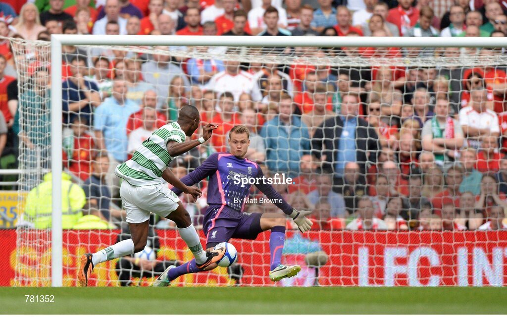 10 August 2013; Amido Balde, Glasgow Celtic XI, shoots past Liverpool XI goalkeeper Simon Mignolet to score his side's first goal. Dublin Decider, Liverpool XI v Glasgow Celtic XI, Aviva Stadium, Lansdowne Road, Dublin. Picture credit: Matt Browne / SPORTSFILE