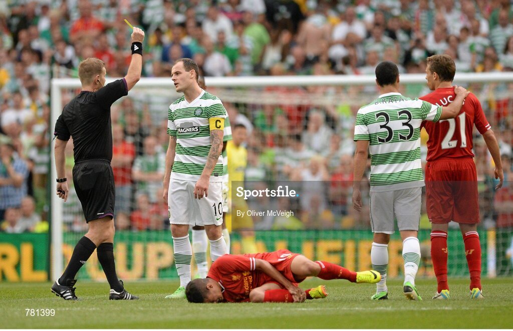 10 August 2013; Anthony Stokes, Glasgow Celtic XI, receives a yellow card from referee Alan Kelly after a foul on Philippe Coutinho, Liverpool XI. Dublin Decider, Liverpool XI v Glasgow Celtic XI, Aviva Stadium, Lansdowne Road, Dublin. Picture credit: Oliver McVeigh / SPORTSFILE