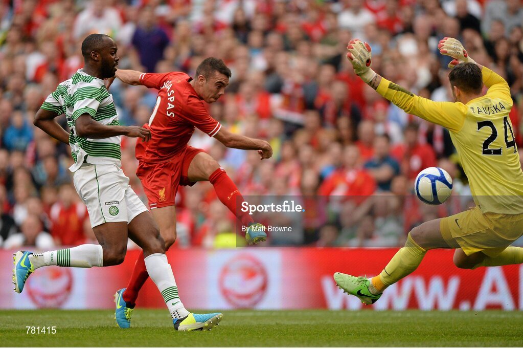 10 August 2013; Iago Aspas, Liverpool XI, has a shot on goal despite the efforts of Steven Mouyokolo, left, and Lucasz Zaluska, Glasgow Celtic XI. Dublin Decider, Liverpool XI v Glasgow Celtic XI, Aviva Stadium, Lansdowne Road, Dublin. Picture credit: Matt Browne / SPORTSFILE