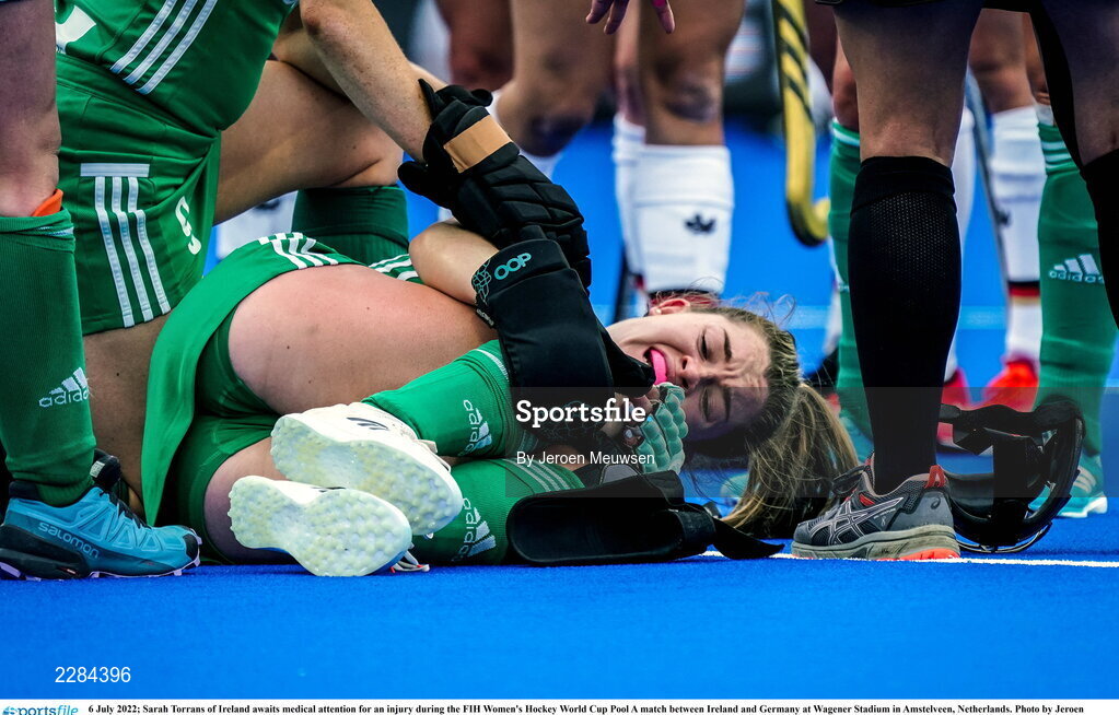 6 July 2022; Sarah Torrans of Ireland awaits medical attention for an injury during the FIH Women's Hockey World Cup Pool A match between Ireland and Germany at Wagener Stadium in Amstelveen, Netherlands. Photo by Jeroen Meuwsen/Sportsfile