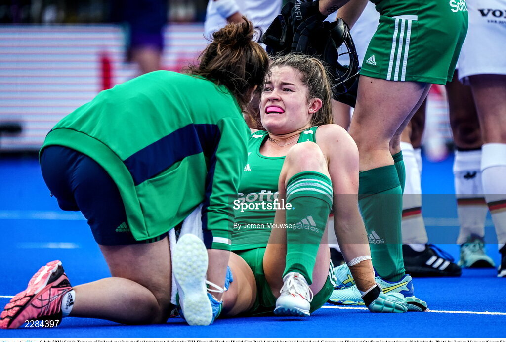 6 July 2022; Sarah Torrans of Ireland receives medical treatment during the FIH Women's Hockey World Cup Pool A match between Ireland and Germany at Wagener Stadium in Amstelveen, Netherlands. Photo by Jeroen Meuwsen/Sportsfile