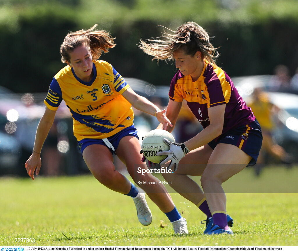 10 July 2022; Aisling Murphy of Wexford in action against Rachel Fitzmaurice of Roscommon during the TG4 All-Ireland Ladies Football Intermediate Championship Semi-Final match between Roscommon and Wexford at Crettyard GAA club, Crettyard, Laois. Photo by Michael P Ryan/Sportsfile