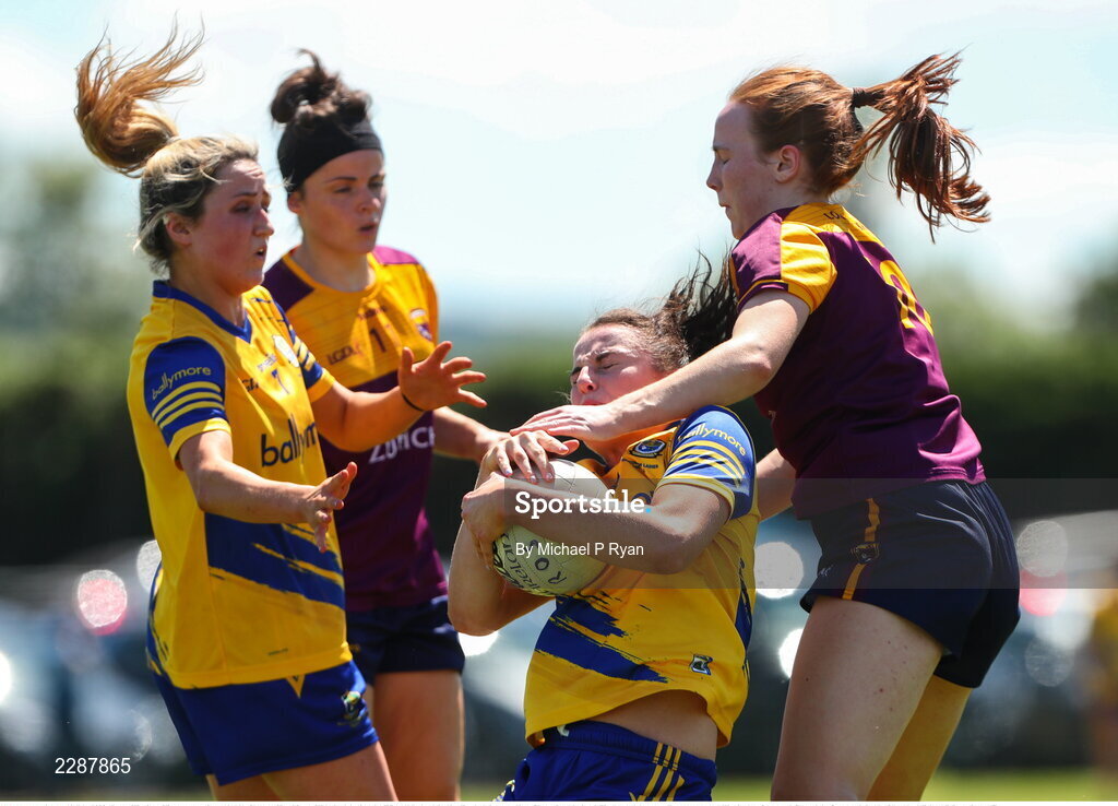 10 July 2022; Jenny Higgins of Roscommon is tackled by Sherene Hamiliton of Wexford during the TG4 All-Ireland Ladies Football Intermediate Championship Semi-Final match between Roscommon and Wexford at Crettyard GAA club, Crettyard, Laois. Photo by Michael P Ryan/Sportsfile