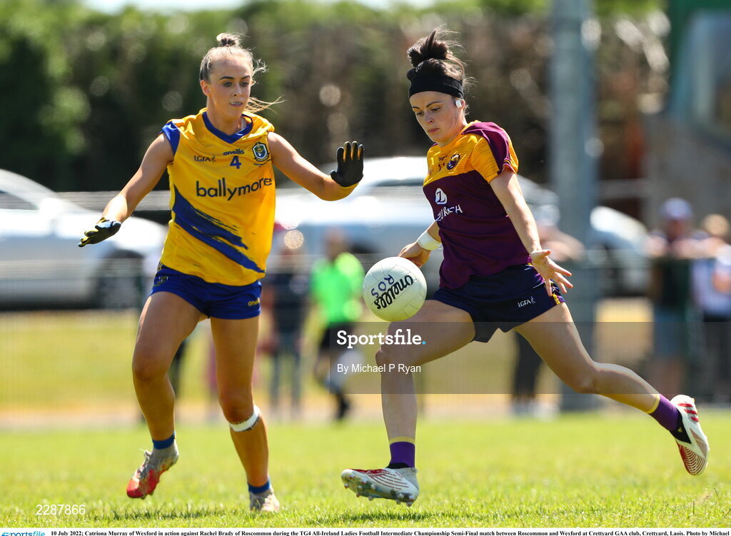 10 July 2022; Catriona Murray of Wexford in action against Rachel Brady of Roscommon during the TG4 All-Ireland Ladies Football Intermediate Championship Semi-Final match between Roscommon and Wexford at Crettyard GAA club, Crettyard, Laois. Photo by Michael P Ryan/Sportsfile