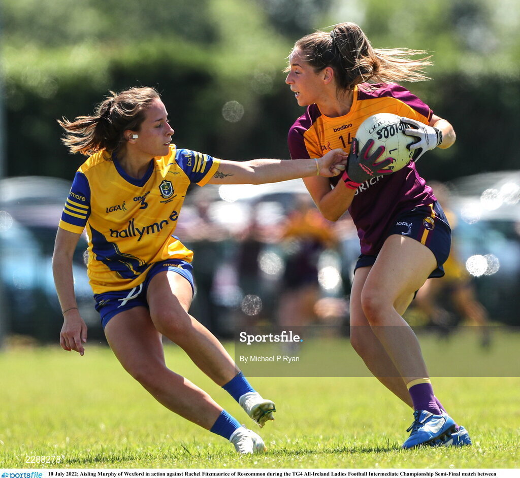 10 July 2022; Aisling Murphy of Wexford in action against Rachel Fitzmaurice of Roscommon during the TG4 All-Ireland Ladies Football Intermediate Championship Semi-Final match between Roscommon and Wexford at Crettyard GAA club, Crettyard, Laois. Photo by Michael P Ryan/Sportsfile
