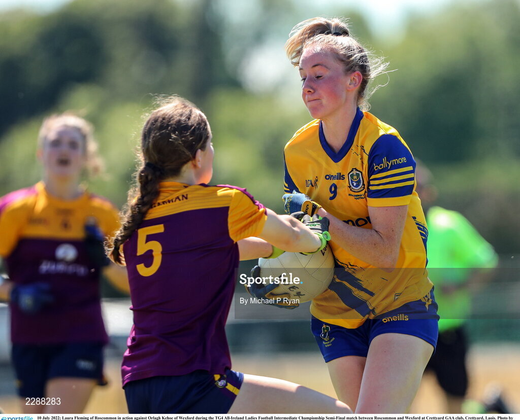 10 July 2022; Laura Fleming of Roscommon in action against Orlagh Kehoe of Wexford during the TG4 All-Ireland Ladies Football Intermediate Championship Semi-Final match between Roscommon and Wexford at Crettyard GAA club, Crettyard, Laois. Photo by Michael P Ryan/Sportsfile