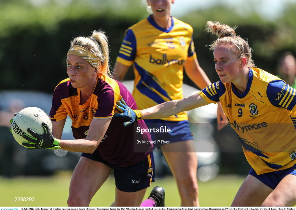 10 July 2022; Kellie Kearney of Wexford in action against Laura Fleming of Roscommon during the TG4 All-Ireland Ladies Football Intermediate Championship Semi-Final match between Roscommon and Wexford at Crettyard GAA club, Crettyard, Laois. Photo by Michael P Ryan/Sportsfile