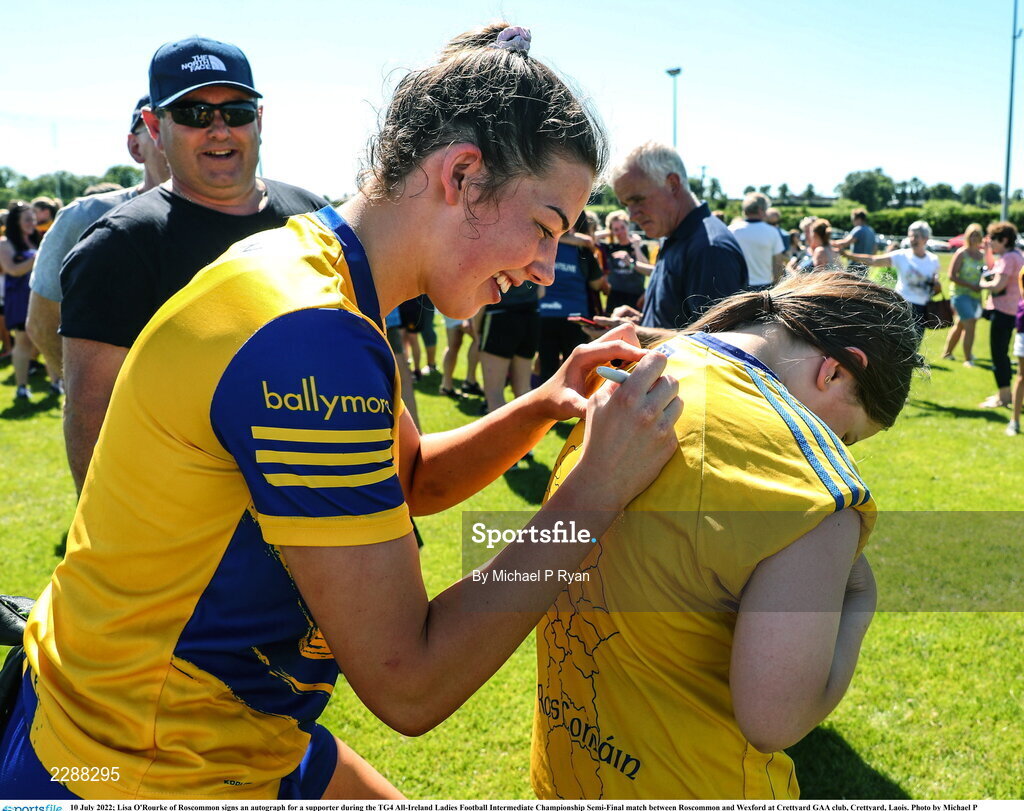 10 July 2022; Lisa O'Rourke of Roscommon signs an autograph for a supporter during the TG4 All-Ireland Ladies Football Intermediate Championship Semi-Final match between Roscommon and Wexford at Crettyard GAA club, Crettyard, Laois. Photo by Michael P Ryan/Sportsfile