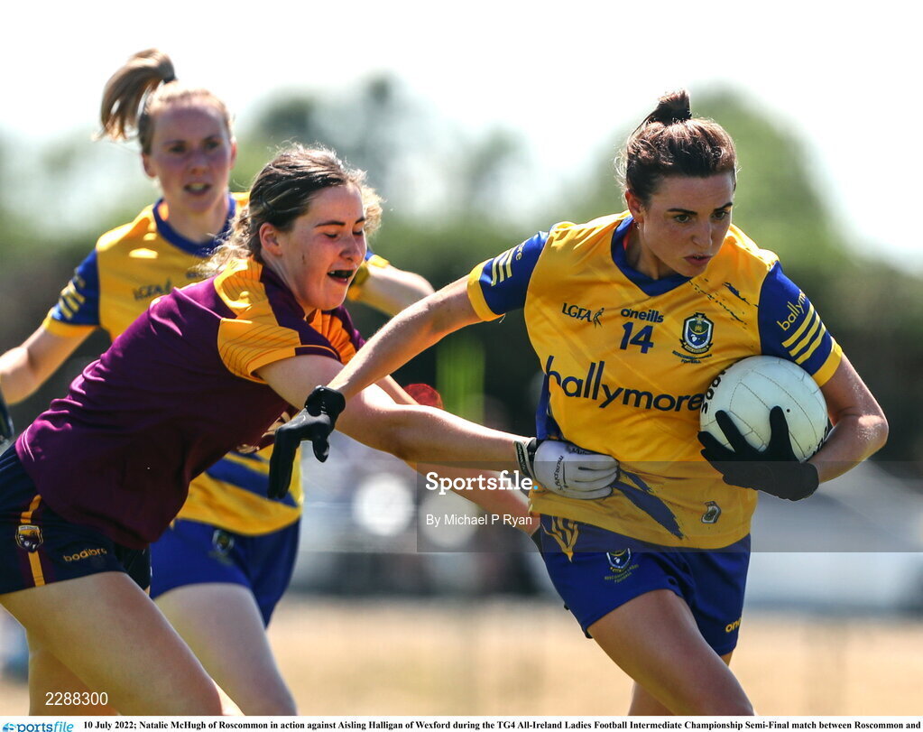 10 July 2022; Natalie McHugh of Roscommon in action against Aisling Halligan of Wexford during the TG4 All-Ireland Ladies Football Intermediate Championship Semi-Final match between Roscommon and Wexford at Crettyard GAA club, Crettyard, Laois. Photo by Michael P Ryan/Sportsfile