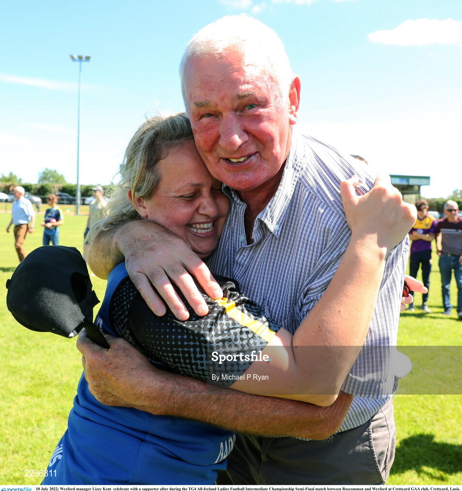 10 July 2022; Wexford manager Lizzy Kent  celebrate with a supporter after during the TG4 All-Ireland Ladies Football Intermediate Championship Semi-Final match between Roscommon and Wexford at Crettyard GAA club, Crettyard, Laois. Photo by Michael P Ryan/Sportsfile
