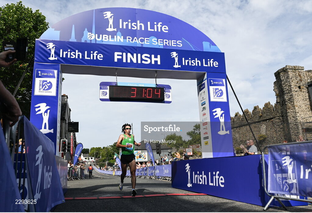 17 July 2022; Mick Clohissey crosses the line to finish second in the Irish Life Dublin Race Series Fingal 10K in Swords, Dublin. Photo by Harry Murphy/Sportsfile
