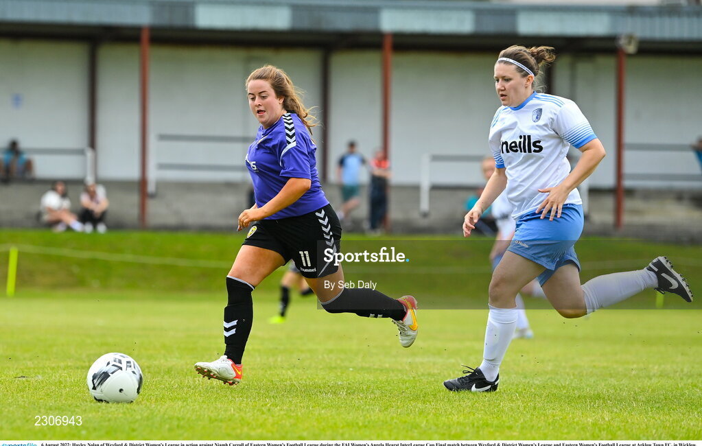 6 August 2022; Hayley Nolan of Wexford & District Women's League in action against Niamh Carroll of Eastern Women's Football League during the FAI Women's Angela Hearst InterLeague Cup Final match between Wexford & District Women's League and Eastern Women's Football League at Arklow Town FC, in Wicklow. Photo by Seb Daly/Sportsfile