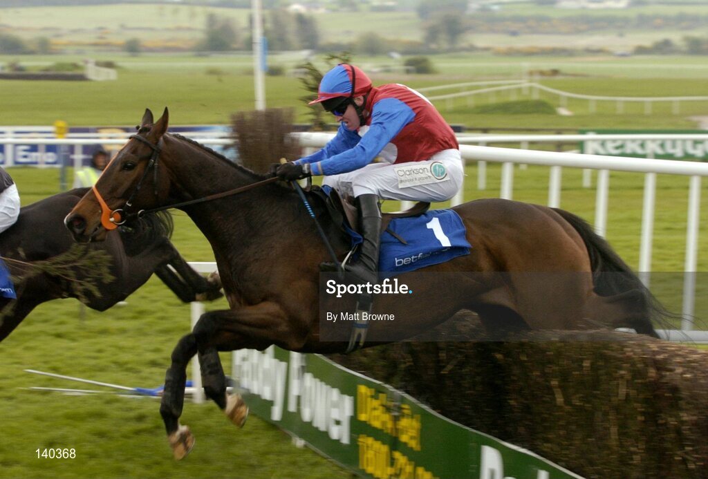 30 April 2004; Emotional Moment, with Barry Geraghty up, jumps the last during the Sharp Minds Betfair Novice Handicap Chase, Punchestown Racecourse, Co. Kildare. Picture credit; Matt Browne / SPORTSFILE