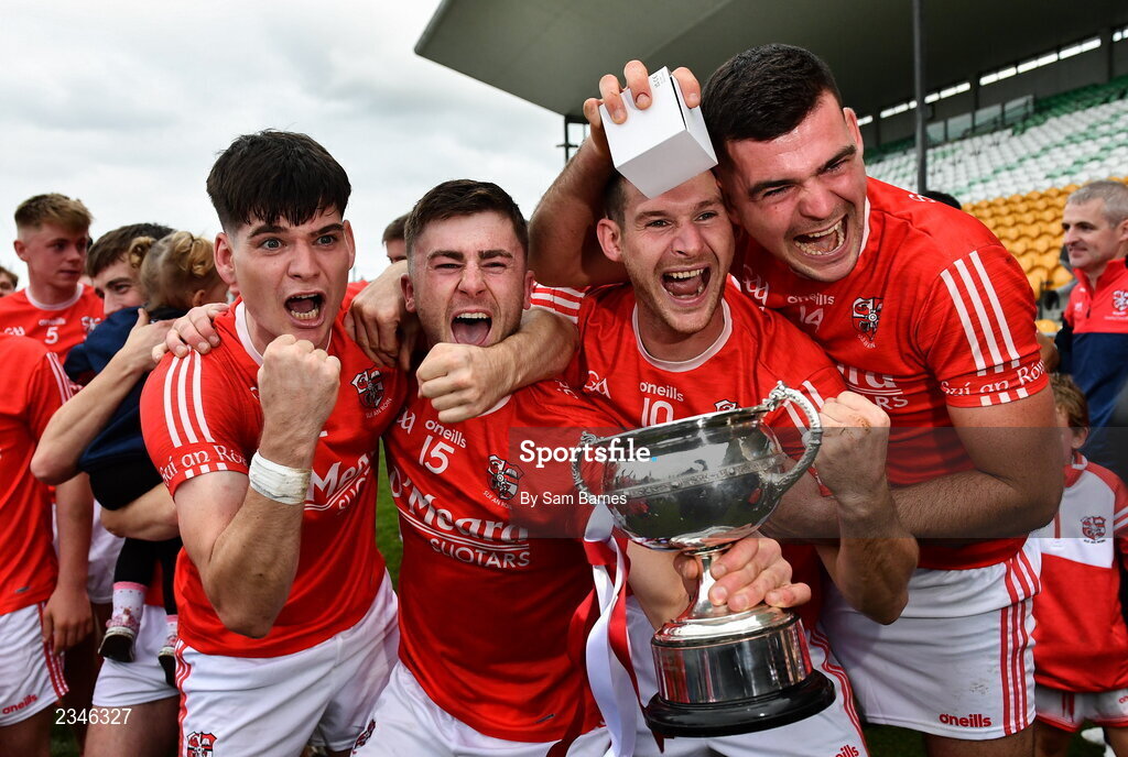 2 October 2022; Shinrone players, from left, Adrian Cleary, Jason Sampson, Sean Cleary and Ciarán Cleary, celebrate with the Sean Robbis cup after their side's victory in the Offaly County Senior Hurling Championship Final match between Kilcormac-Killoughey and Shinrone at O'Connor Park in Tullamore, Offaly. Photo by Sam Barnes/Sportsfile