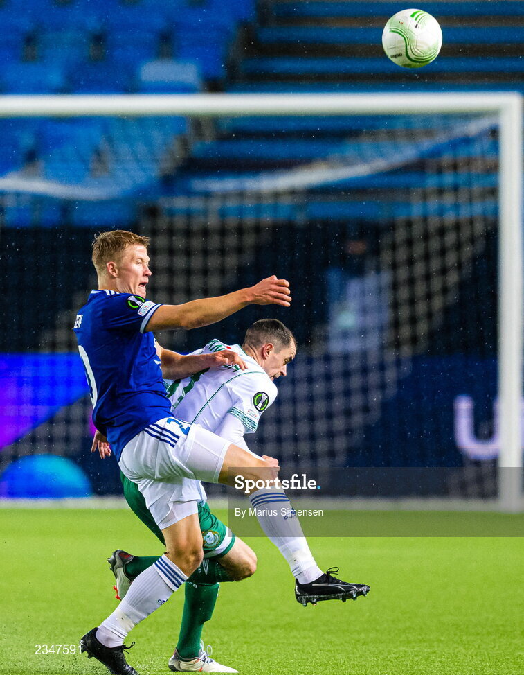 6 October 2022; Kristian Eriksen of Molde in action against Sean Kavanagh of Shamrock Rovers during the UEFA Europa Conference League group F match between Molde and Shamrock Rovers at Aker Stadion in Molde, Norway. Photo by Marius Simensen/Sportsfile