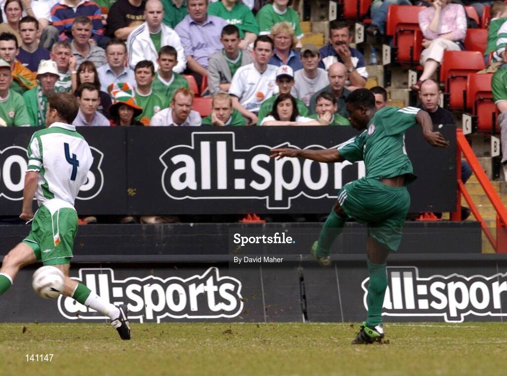 29 May 2004; Bartholomew Ogbeche, Nigeria, beats Kenny Cunningham, Republic of Ireland, to score his sides first goal. Unity Cup, Republic of Ireland v Nigeria, The Valley, London. Picture credit; David Maher / SPORTSFILE