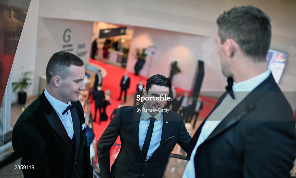 28 October 2022; Chrissy McKaigue of Derry, centre, and Ciarán Kilkenny of Dublin, left, arrive for the PwC All-Stars Awards 2022 show at the Convention Centre in Dublin. Photo by Ramsey Cardy/Sportsfile