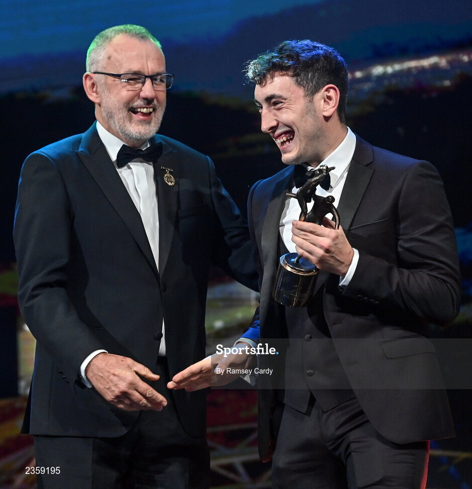 28 October 2022; Paudie Clifford of Kerry is presented with his PwC All-Star award by Uachtarán Chumann Lúthchleas Gael Larry McCarthy during the PwC All-Stars Awards 2022 show at the Convention Centre in Dublin. Photo by Ramsey Cardy/Sportsfile