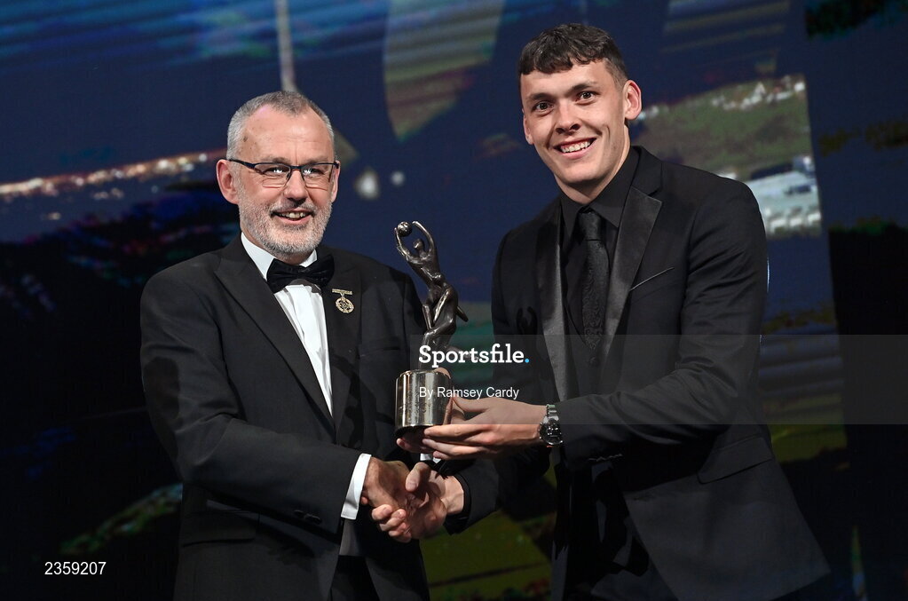 28 October 2022; David Clifford of Kerry is presented with his PwC All-Star award by Uachtarán Chumann Lúthchleas Gael Larry McCarthy during the PwC All-Stars Awards 2022 show at the Convention Centre in Dublin. Photo by Ramsey Cardy/Sportsfile