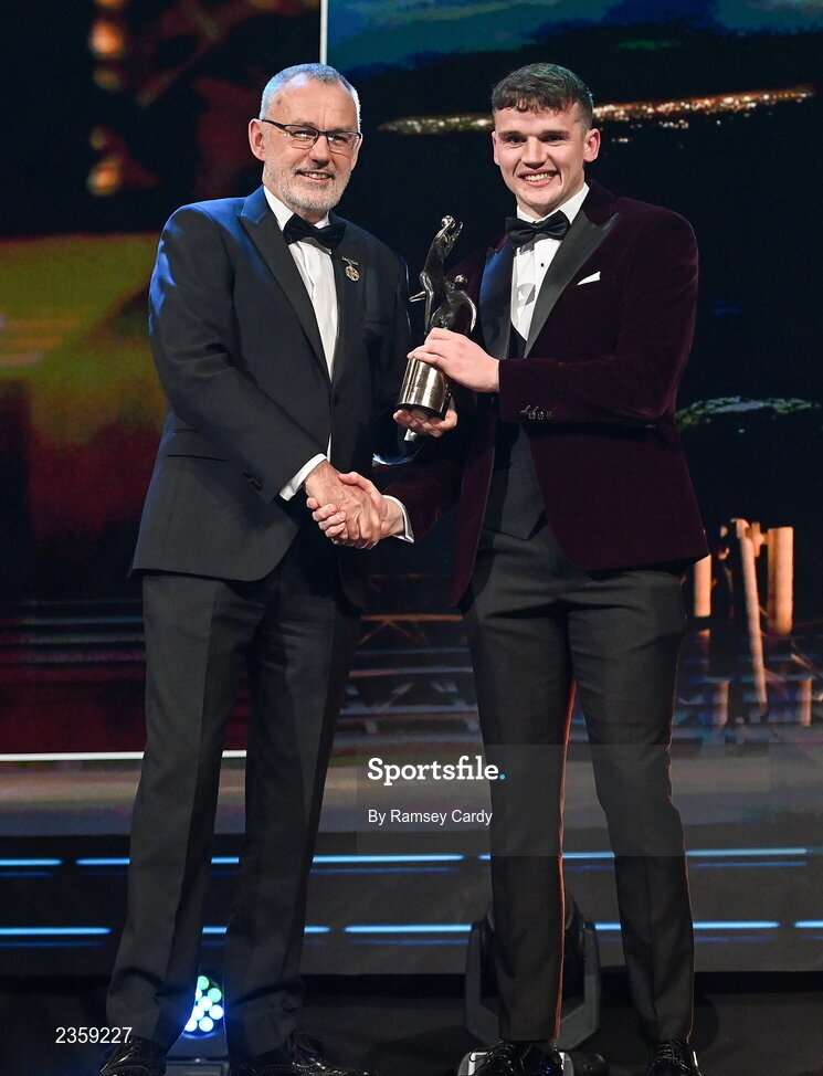 28 October 2022; John Daly of Galway is presented with his PwC All-Star award by Uachtarán Chumann Lúthchleas Gael Larry McCarthy during the PwC All-Stars Awards 2022 show at the Convention Centre in Dublin. Photo by Ramsey Cardy/Sportsfile