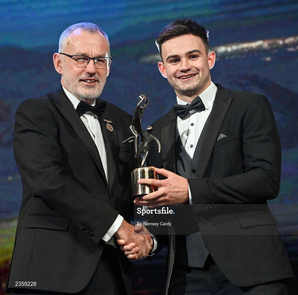 28 October 2022; Cillian McDaid of Galway is presented with his PwC All-Star award by Uachtarán Chumann Lúthchleas Gael Larry McCarthy during the PwC All-Stars Awards 2022 show at the Convention Centre in Dublin. Photo by Ramsey Cardy/Sportsfile