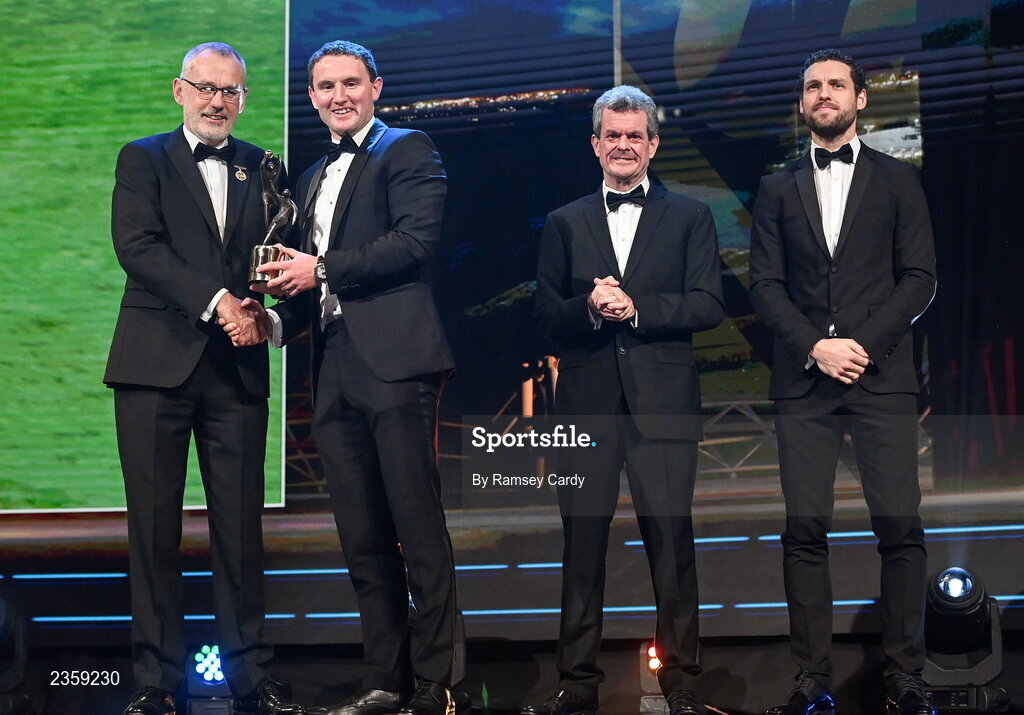 28 October 2022; Tadhg Morley of Kerry is presented with his PwC All-Star award by Uachtarán Chumann Lúthchleas Gael Larry McCarthy, PwC Ireland managing partner Feargal O'Rourke and GPA chief executive officer Tom Parsons during the PwC All-Stars Awards 2022 show at the Convention Centre in Dublin. Photo by Ramsey Cardy/Sportsfile