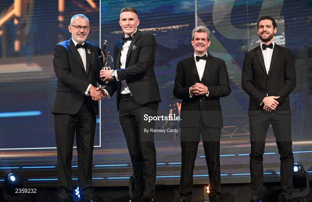 28 October 2022; Jason Foley of Kerry is presented with his PwC All-Star award by Uachtarán Chumann Lúthchleas Gael Larry McCarthy, PwC Ireland managing partner Feargal O'Rourke and GPA chief executive officer Tom Parsons during the PwC All-Stars Awards 2022 show at the Convention Centre in Dublin. Photo by Ramsey Cardy/Sportsfile