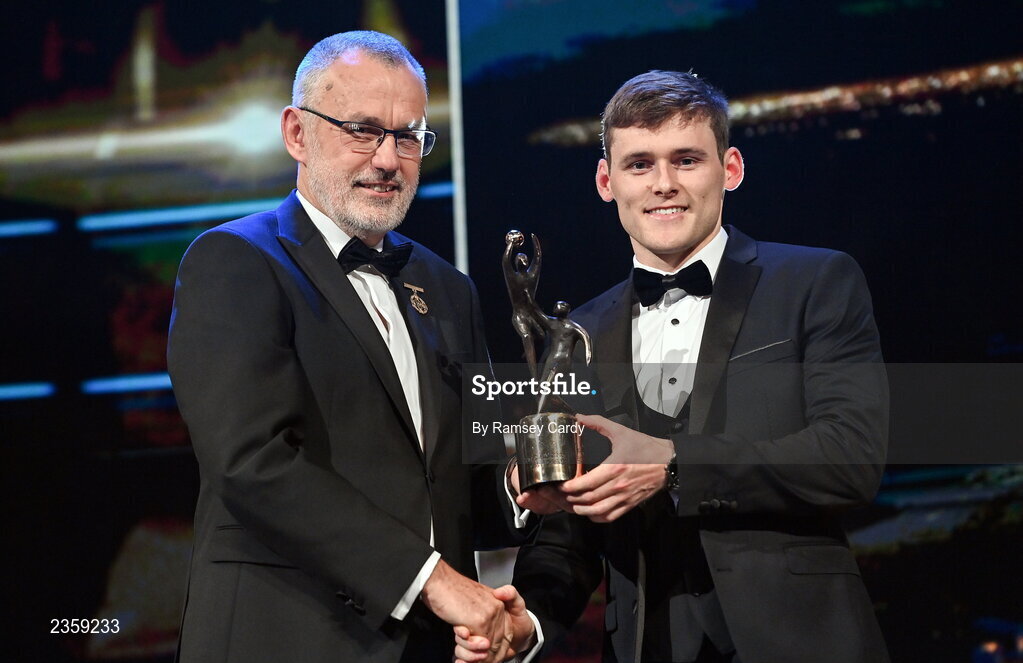 28 October 2022; Gavin White of Kerry is presented with his PwC All-Star award by Uachtarán Chumann Lúthchleas Gael Larry McCarthy during the PwC All-Stars Awards 2022 show at the Convention Centre in Dublin. Photo by Ramsey Cardy/Sportsfile