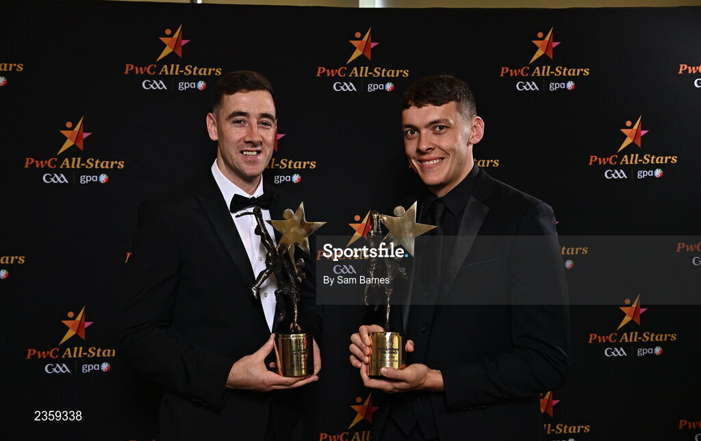 28 October 2022; Diarmaid Byrnes of Limerick, left, and David Clifford of Kerry, with their PwC All Star Player of the Year awards at the PwC All-Stars Awards 2022 at the Convention Centre in Dublin. Photo by Sam Barnes/Sportsfile