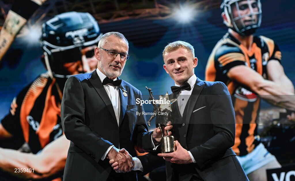 28 October 2022; Mikey Butler of Kilkenny is presented with his PwC GAA GPA Young Player of the Year award by Uachtarán Chumann Lúthchleas Gael Larry McCarthy during the PwC All-Stars Awards 2022 show at the Convention Centre in Dublin. Photo by Ramsey Cardy/Sportsfile