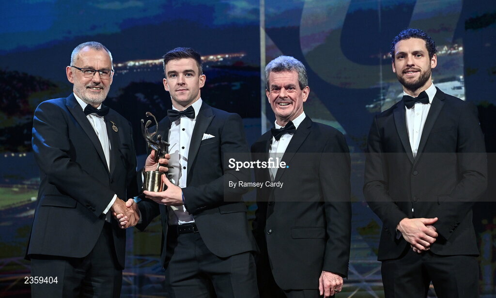 28 October 2022; Tony Kelly of Clare is presented with his PwC All-Star award by Uachtarán Chumann Lúthchleas Gael Larry McCarthy, PwC Ireland managing partner Feargal O'Rourke and GPA chief executive officer Tom Parsons during the PwC All-Stars Awards 2022 show at the Convention Centre in Dublin. Photo by Ramsey Cardy/Sportsfile