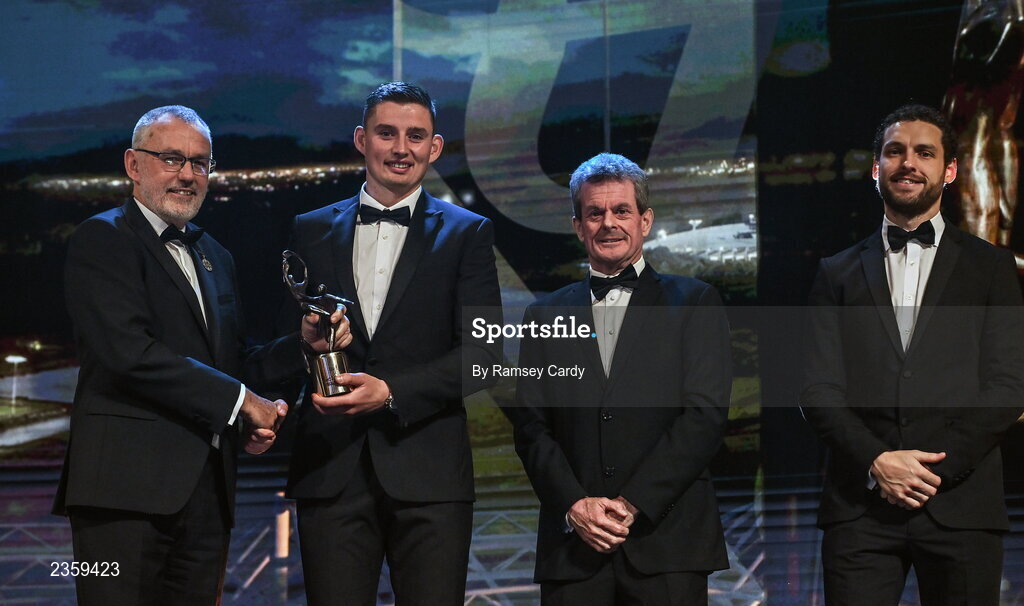 28 October 2022; Gearóid Hegarty of Limerick is presented with his PwC All-Star award by Uachtarán Chumann Lúthchleas Gael Larry McCarthy, PwC Ireland managing partner Feargal O'Rourke and GPA chief executive officer Tom Parsons during the PwC All-Stars Awards 2022 show at the Convention Centre in Dublin. Photo by Ramsey Cardy/Sportsfile