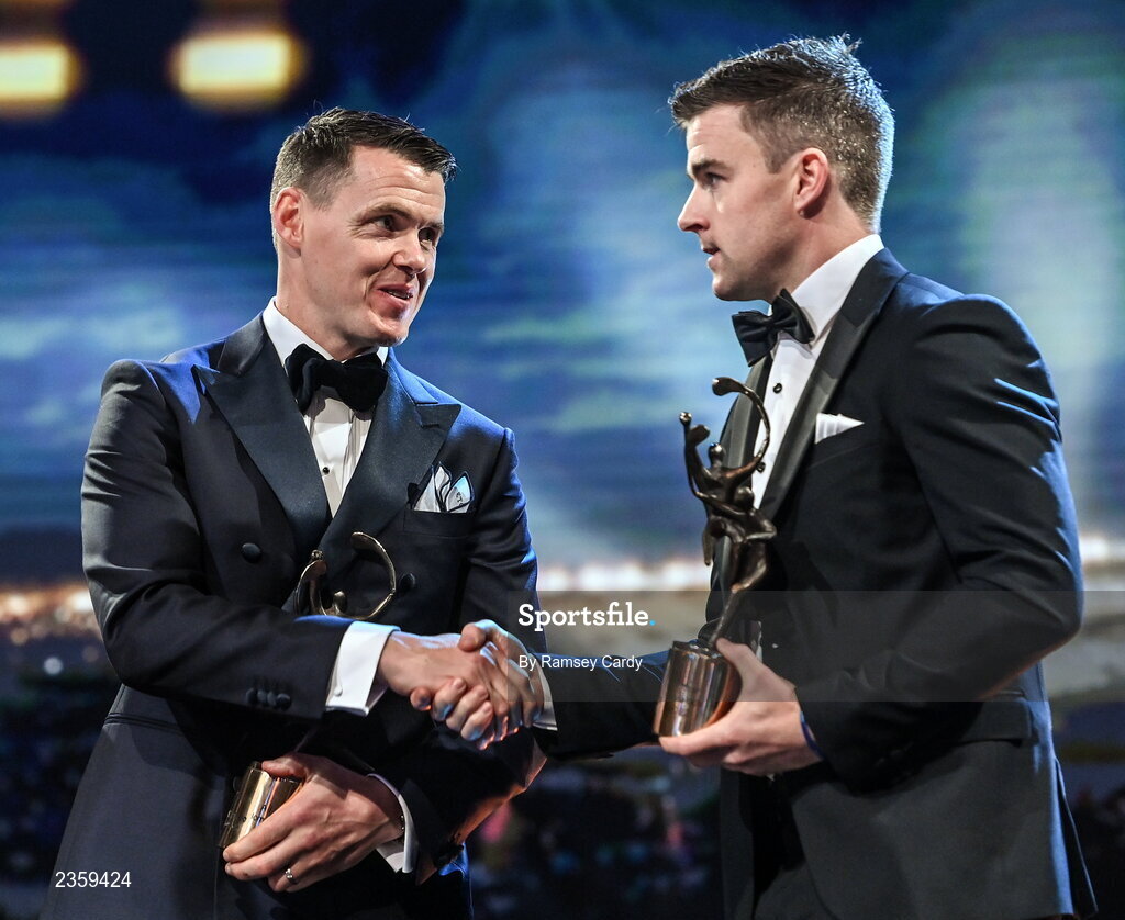 28 October 2022; Hurlers TJ Reid of Kilkenny, left, and Tony Kelly of Clare with their PwC All-Star award during the PwC All-Stars Awards 2022 show at the Convention Centre in Dublin. Photo by Ramsey Cardy/Sportsfile
