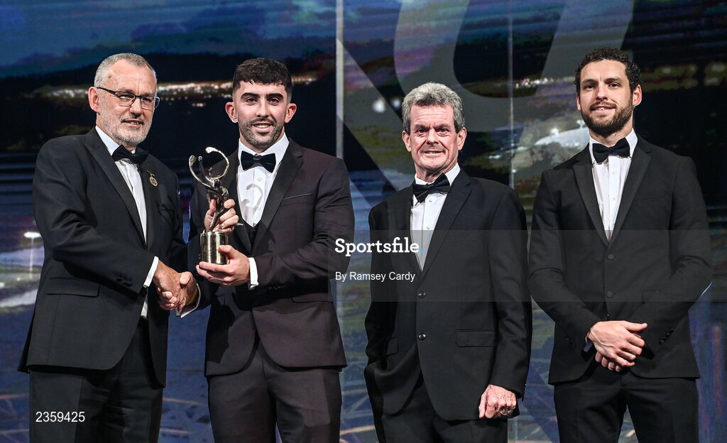 28 October 2022; Aaron Gillane of Limerick is presented with his PwC All-Star award by Uachtarán Chumann Lúthchleas Gael Larry McCarthy, PwC Ireland managing partner Feargal O'Rourke and GPA chief executive officer Tom Parsons during the PwC All-Stars Awards 2022 show at the Convention Centre in Dublin. Photo by Ramsey Cardy/Sportsfile