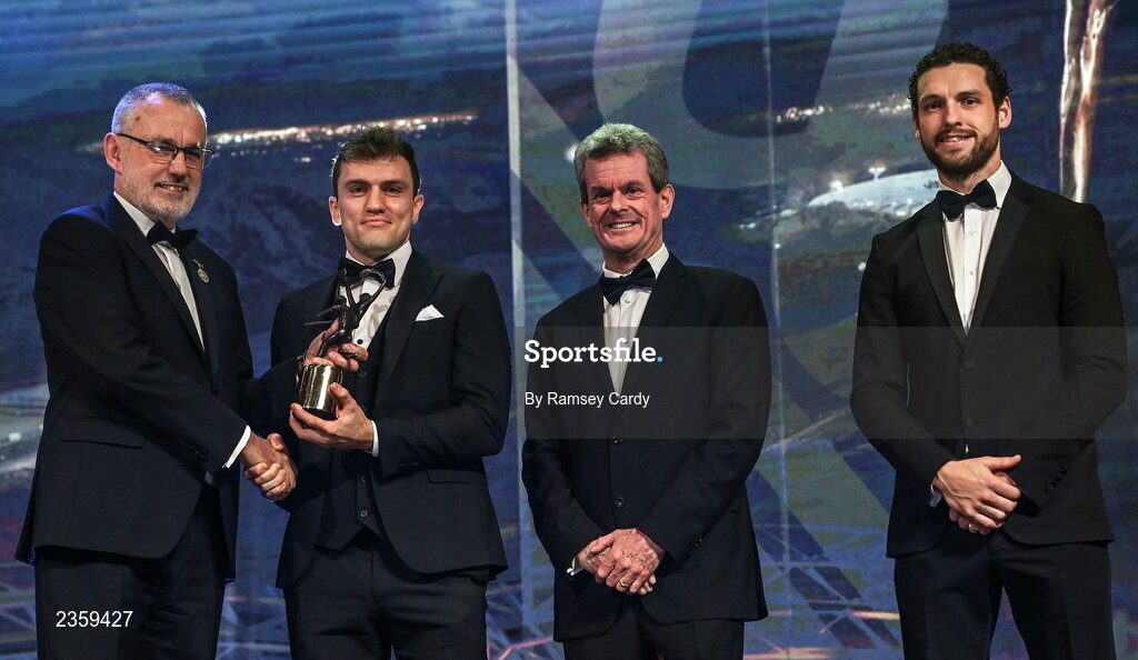 28 October 2022; Shane O’Donnell of Clare is presented with his PwC All-Star award by Uachtarán Chumann Lúthchleas Gael Larry McCarthy, PwC Ireland managing partner Feargal O'Rourke and GPA chief executive officer Tom Parsons during the PwC All-Stars Awards 2022 show at the Convention Centre in Dublin. Photo by Ramsey Cardy/Sportsfile