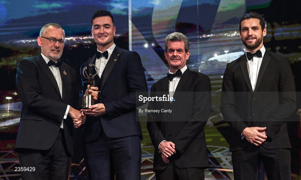 28 October 2022; Kyle Hayes of Limerick is presented with his PwC All-Star award by Uachtarán Chumann Lúthchleas Gael Larry McCarthy, PwC Ireland managing partner Feargal O'Rourke and GPA chief executive officer Tom Parsons during the PwC All-Stars Awards 2022 show at the Convention Centre in Dublin. Photo by Ramsey Cardy/Sportsfile