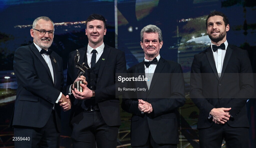 28 October 2022; Declan Hannon of Limerick is presented with his PwC All-Star award by Uachtarán Chumann Lúthchleas Gael Larry McCarthy, PwC Ireland managing partner Feargal O'Rourke and GPA chief executive officer Tom Parsons during the PwC All-Stars Awards 2022 show at the Convention Centre in Dublin. Photo by Ramsey Cardy/Sportsfile