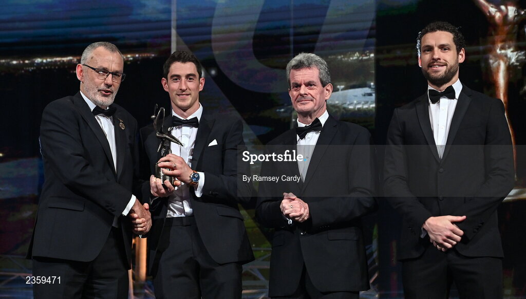 28 October 2022; Nickie Quaid of Limerick is presented with his PwC All-Star award by Uachtarán Chumann Lúthchleas Gael Larry McCarthy, PwC Ireland managing partner Feargal O'Rourke and GPA chief executive officer Tom Parsons during the PwC All-Stars Awards 2022 show at the Convention Centre in Dublin. Photo by Ramsey Cardy/Sportsfile