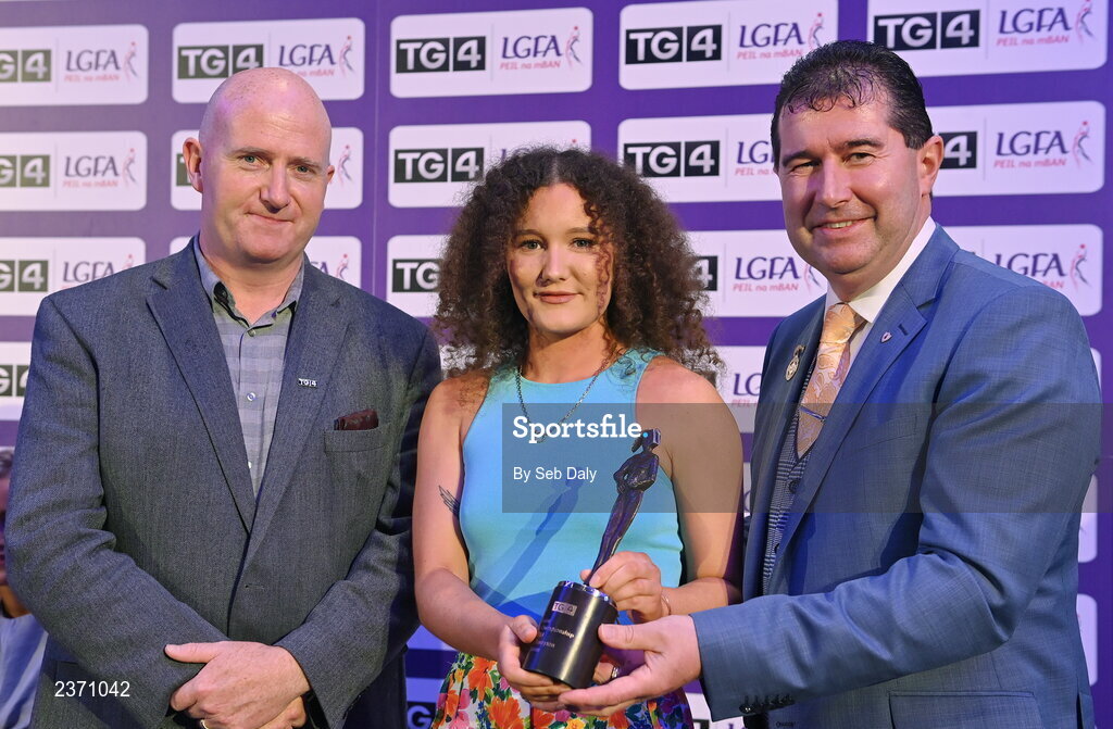 4 November 2022; Saoirse Tennyson of Antrim is presented with her TG4 Junior Team of the Championship award by Mícheál Naughton, LGFA President, right, and Rónán Ó Coisdealbha, Head of Sport, TG4, at the 2022 TG4 Teams of the Championship awards night at Croke Park, Dublin. Photo by Seb Daly/Sportsfile