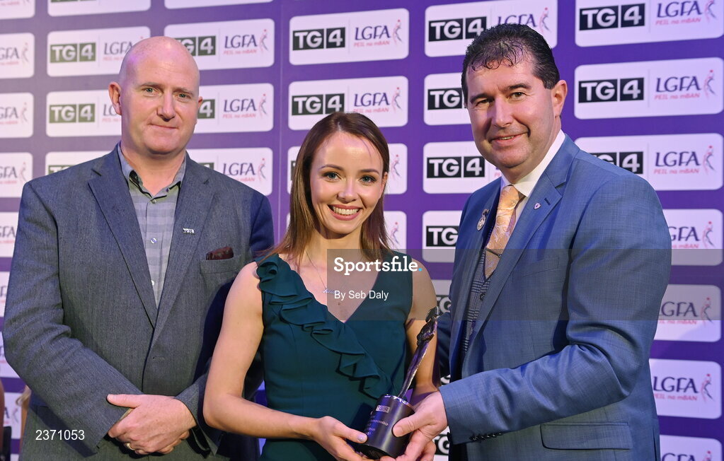 4 November 2022; Aisling O’Brien of Fermanagh is presented with her TG4 Junior Team of the Championship award by Mícheál Naughton, LGFA President, right, and Rónán Ó Coisdealbha, Head of Sport, TG4, at the 2022 TG4 Teams of the Championship awards night at Croke Park, Dublin. Photo by Seb Daly/Sportsfile