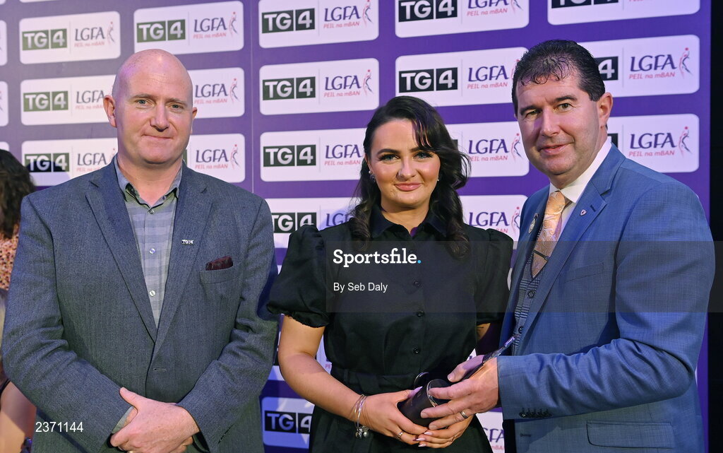 4 November 2022; Erone Fitzpatrick of Laois is presented with her TG4 Intermediate Team of the Championship award by Mícheál Naughton, LGFA President, right, and Rónán Ó Coisdealbha, Head of Sport, TG4, at the 2022 TG4 Teams of the Championship awards night at Croke Park, Dublin. Photo by Seb Daly/Sportsfile