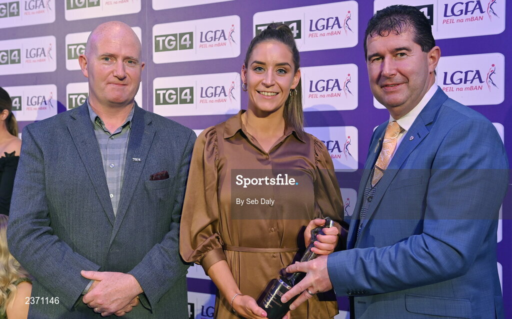 4 November 2022; Aisling Murphy of Wexford is presented with her TG4 Intermediate Team of the Championship award by Mícheál Naughton, LGFA President, right, and Rónán Ó Coisdealbha, Head of Sport, TG4, at the 2022 TG4 Teams of the Championship awards night at Croke Park, Dublin. Photo by Seb Daly/Sportsfile